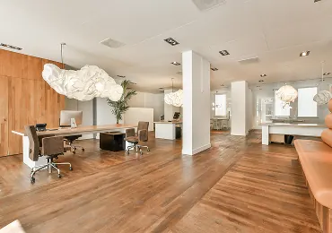 Office with wood flooring and modern furniture