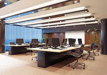 Open-plan office with workstations and IT infrastructure