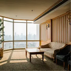 Penthouse living room with timber wall panelling and city view in Dubai