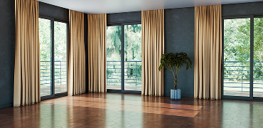 Office with wall-to-wall carpet and floor-length curtains