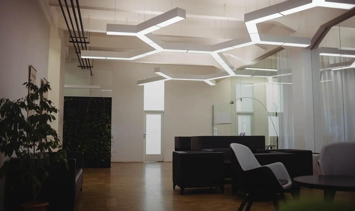 Office interior with hexagonal LED ceiling lighting after fit-out