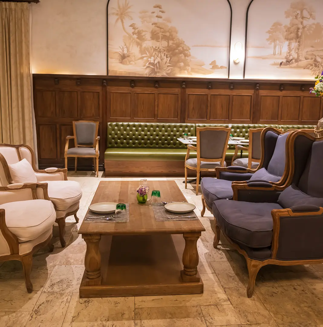 Lounge with custom upholstered furniture and timber panelling