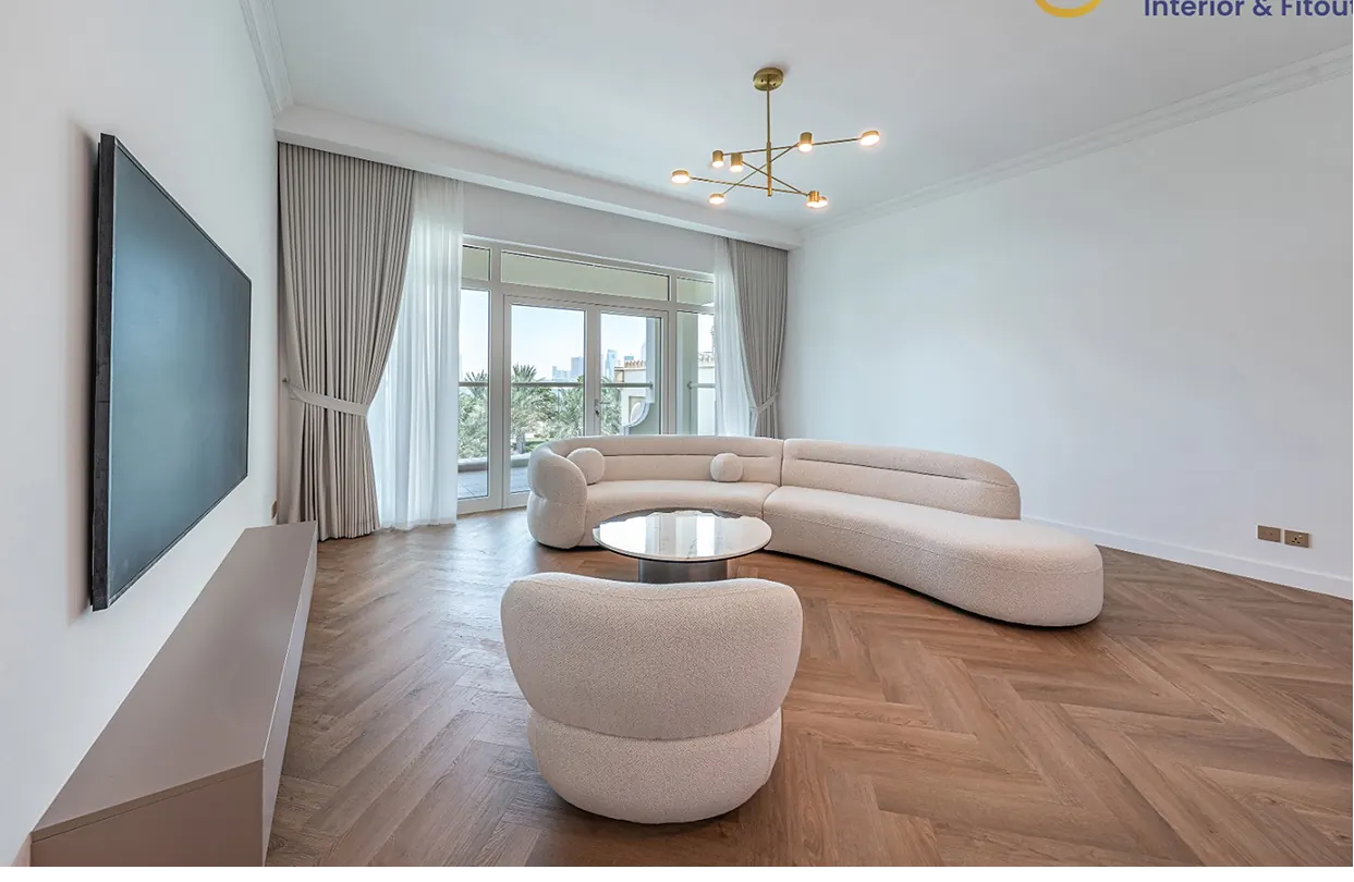 Bright living room with herringbone wood flooring in a Dubai villa